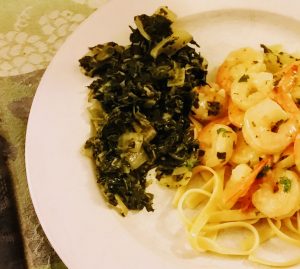 Sauteed spinach along side shrimp scampi